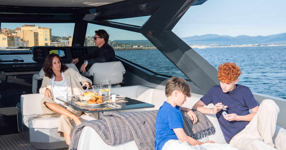 Family relaxing in the Santasevera 52 cockpit lounge with views over St. Tropez